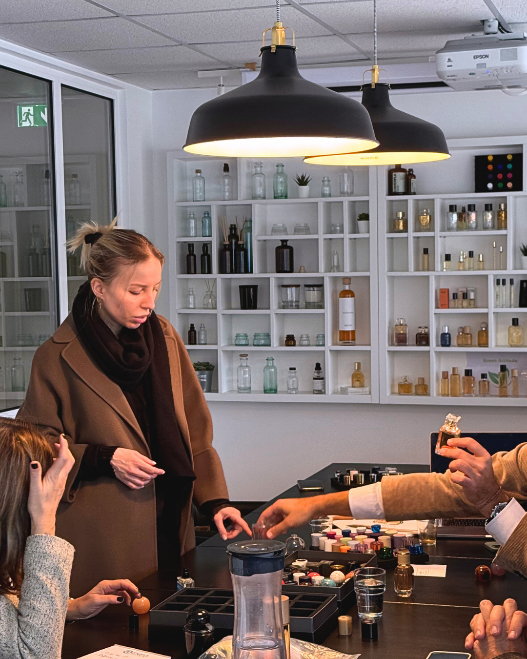 Emma Zepter at the perfume creation table with blotters and samples